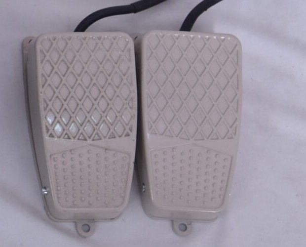 The two foot pedals supplied with the machine